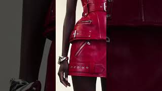 A Welsh red biker corset and skirt with zip detailing. #AlexanderMcQueen #McQueenPreAW23