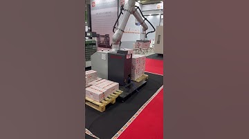 A robotic arm moves boxes. #business #export #machine #robot