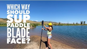 Which way should SUP paddle blade face?