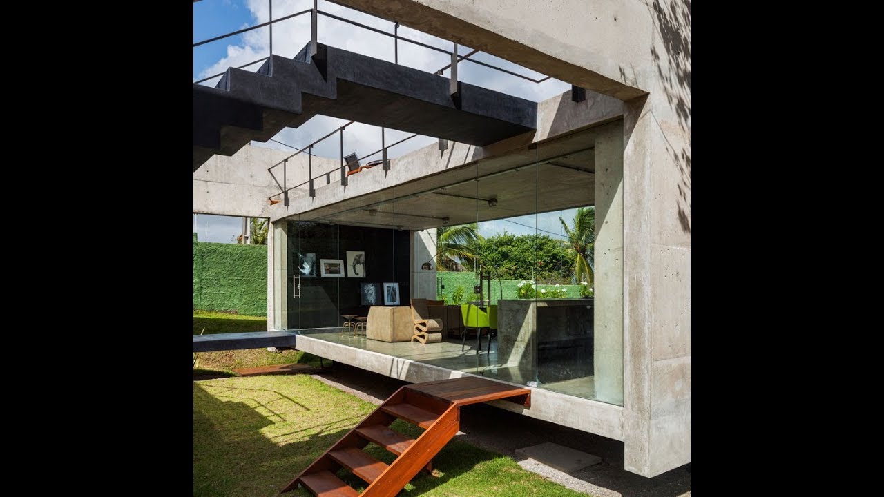 Modern Concrete House with Two Separate Elevated  Buildings 