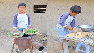 Little boy Heng cook fry water spinach