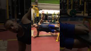 Elevated bench side plank with leg tuck knee squeeze to bench