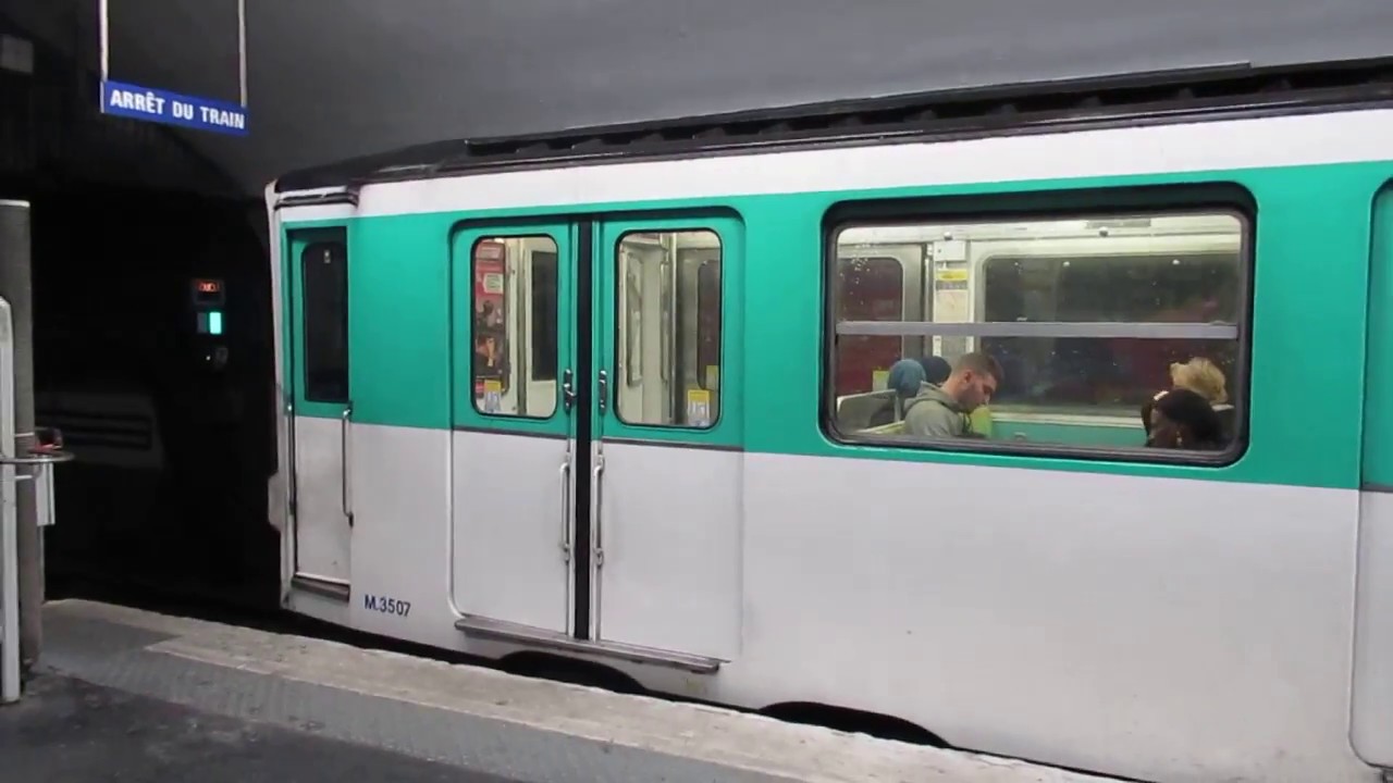 France Paris Metro train of rubber tyred MP73 stock leaves Nation