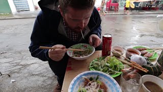 American Man eating like he hasn't eaten in years - American enjoys Vietnam street food of HUE city