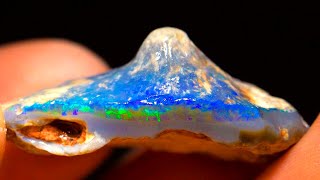 Uncut gem, erupting with color gets cut open and polished