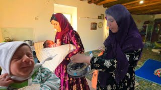 The routine of a village woman in Iran.  Zulikha bakes local bread after milking the goats