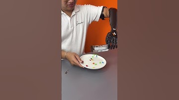 Candy with ROBOT HAND! #asmr #mukbang #prosthetics #disability #bionics #shorts #mandms #chocolates