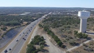 TxDOT crews cleaning up a site that was used as a dump site