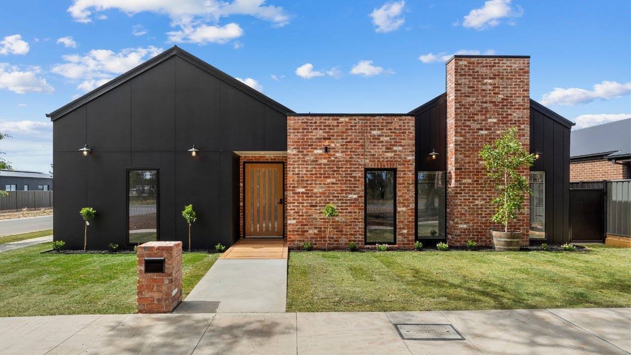 Modern black clad home with recycled brick chimney at 13 Goldie Street, Marong