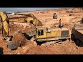 Caterpillar 245B Excavator Loading MAN And Mercedes Trucks With Three Passes