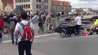 People walking and riding bikes at the Trangravsbroen (Butterfly Bridge) in Copenhagen