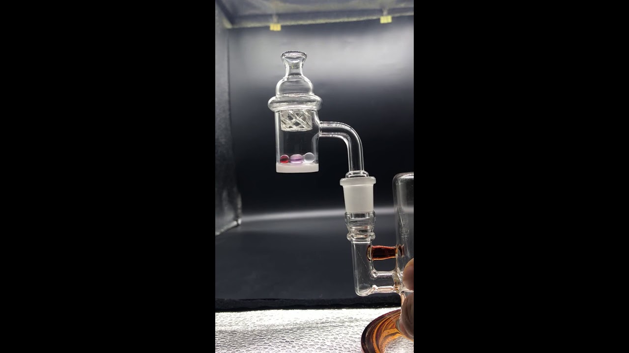 Quartz banger nail with glass spinning carb cap