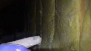 Diagnosing problems in a knee wall of a new home.