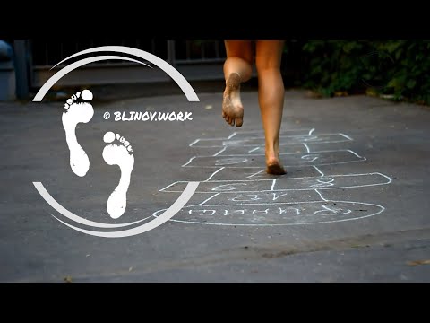 Barefoot hippie girl playing hopscotch ツ