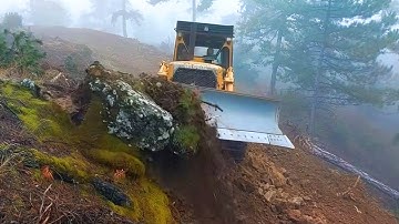 To Transformation From Tree‑Covered Hills to Dirt Road by Bulldozer Cat D7G