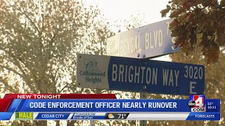 Code enforcement officer nearly hit by vehicle while picking up election signs