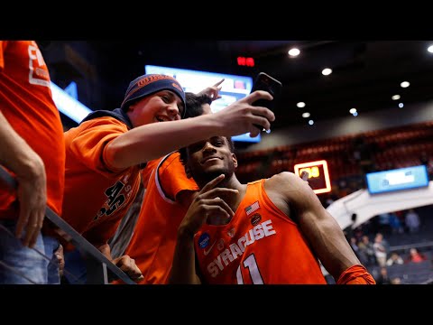 Syracuse hangs on