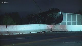 Cleveland crash leaves car hanging over bridge