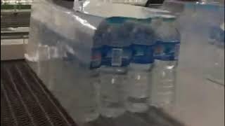 High speed water bottle sleeve shrink wrapping machine