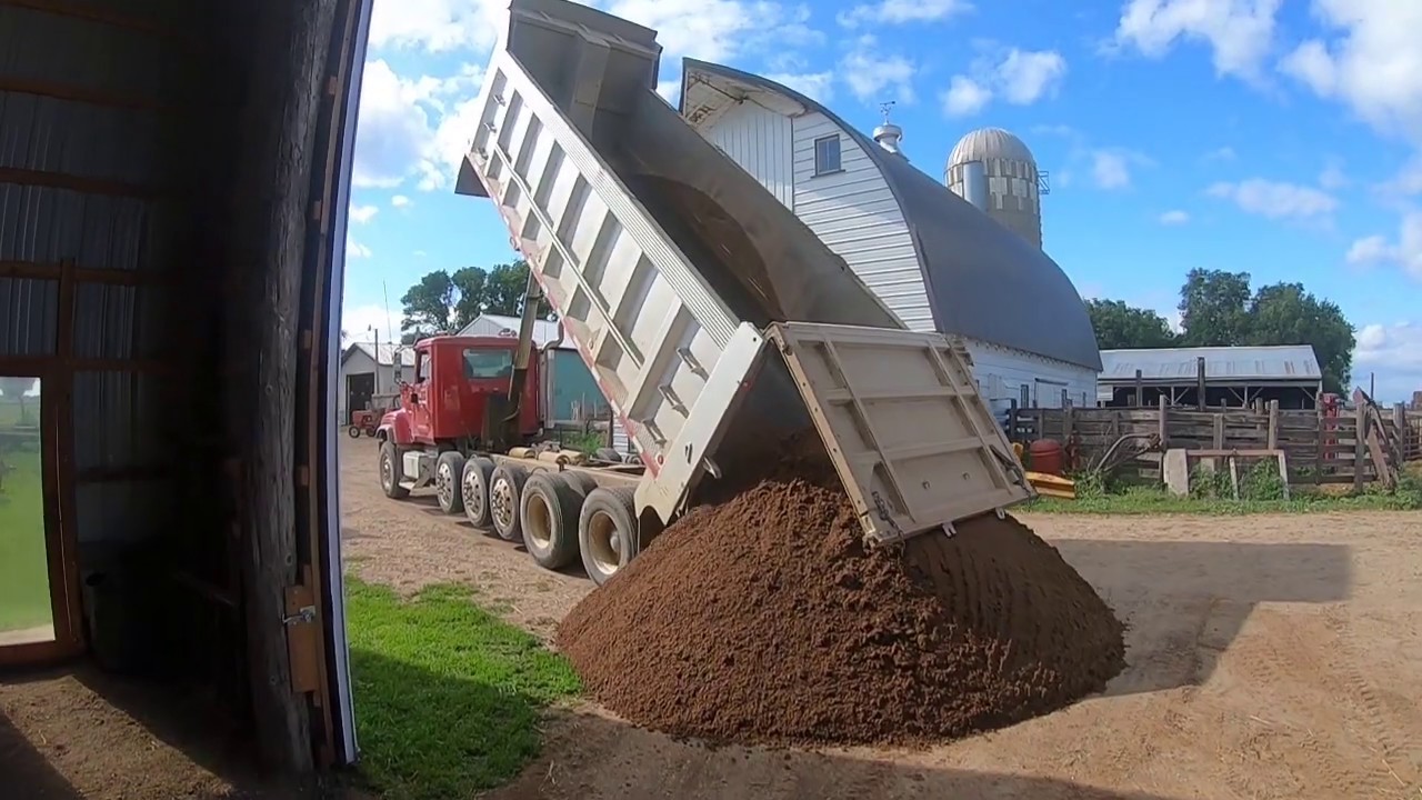 Adding gravel to the new shed - YouTube