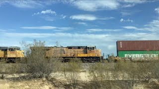 A UP westbound stack train passes fast on the Gila Sub along with mid DPUS