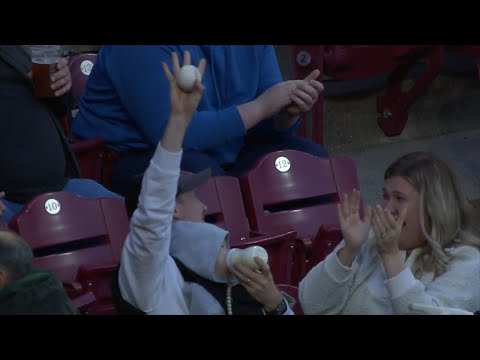 EPIC-FAN-CATCH-Man-catches-foul-ball-while-bottle-feeding-baby-at-Reds-game
