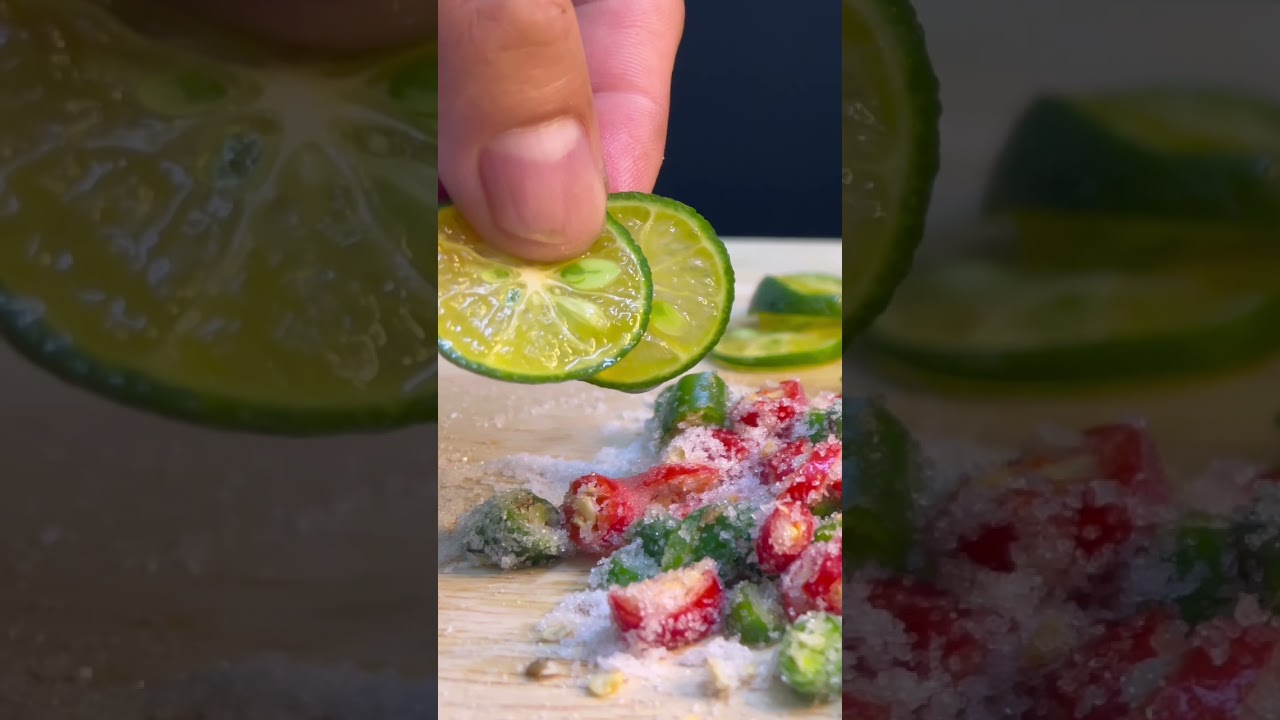 Mouth watering lime eating with spicy salt