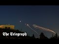 Hezbollah fires dozens of missiles at Israel