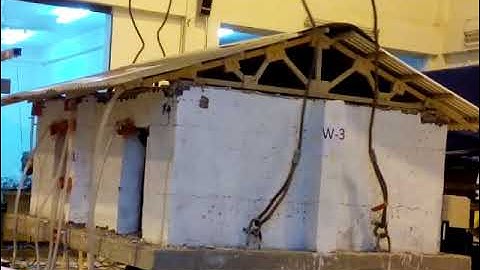 Shaking-table testing of low-strength stone masonry retrofitted using low-cost technique