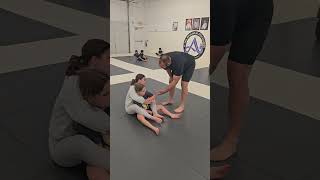 Coach Adam introducing a new student to back control #bjj #kidsbjj #learnthroughplay
