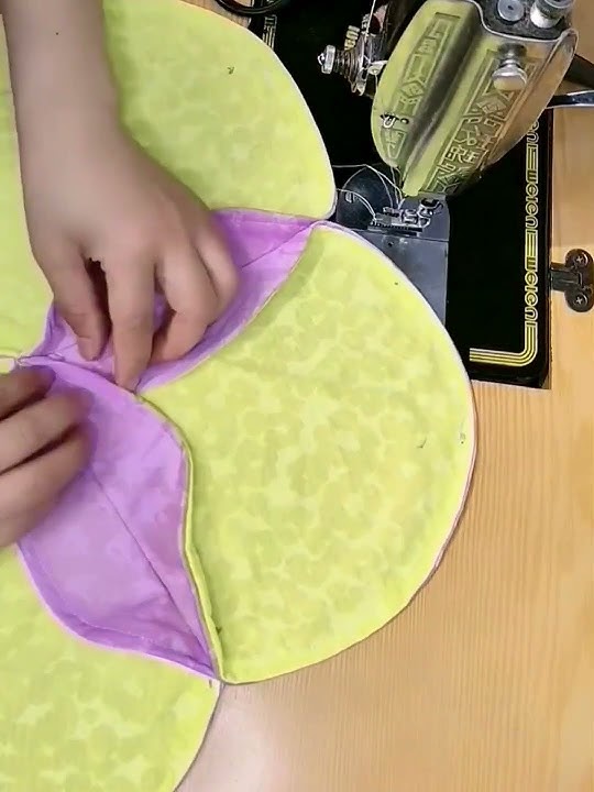 Sew throw pillows with nine round pieces of fabric