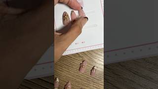 NUDE PINK NAILS WITH EMBOSSED FLOWER AMD GOLD DESIGN