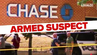 Armed suspect shot killed by witness during Chase bank robbery police