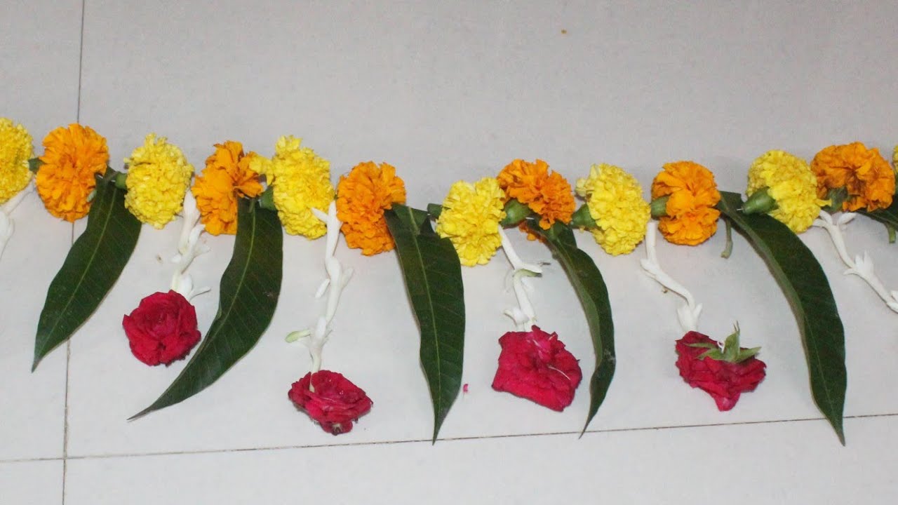 Festival Toran With Marigold Flowers and Mango Leaves Diwali Decoration ...