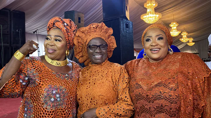 MADAM SAJE KISSES IMAGE OF HER LATE MOTHER AT THE REMEMBRANCE CEREMONY IN LAGOS