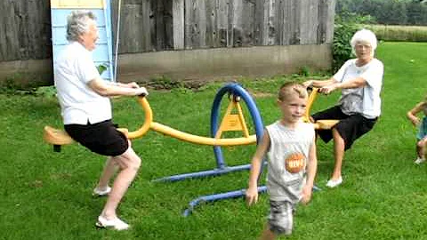 Frieda & Melva Old ladies on teeter totter see saw