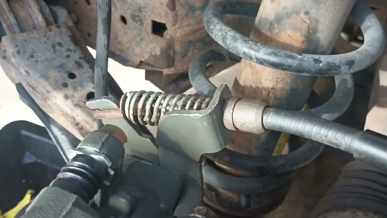Ford Five Hundred (how to remove rear caliper parking brake cable)