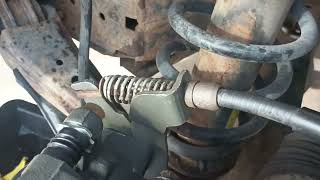 Ford Five Hundred (how to remove rear caliper parking brake cable) Parking Brake Cable Trick For Rear Caliper Replacement