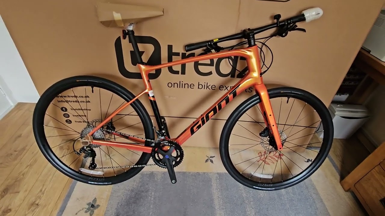 Unboxing Giant FastRoad Advanced 2 Helios Orange. From Tredz