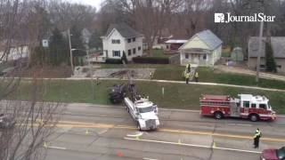 Retrieving van after accident on War Memorial Drive in Peoria Tuesday.