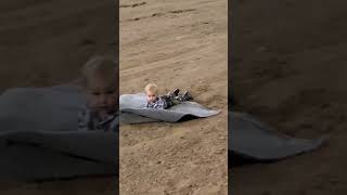 Precious Boy Slips Off Rug Getting Pulled in Rug Race