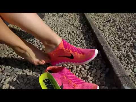 Her Nike Free Flyknit sockless shoeplay.