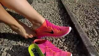 Her Nike Free Flyknit Sockless Shoeplay.