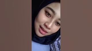 The beautiful lips of a beautiful girl wearing an Asian hijab style, Indonesian hijab, are indeed...