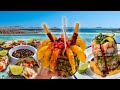 Cooking A Seafood Feast On The Beach In Mexico