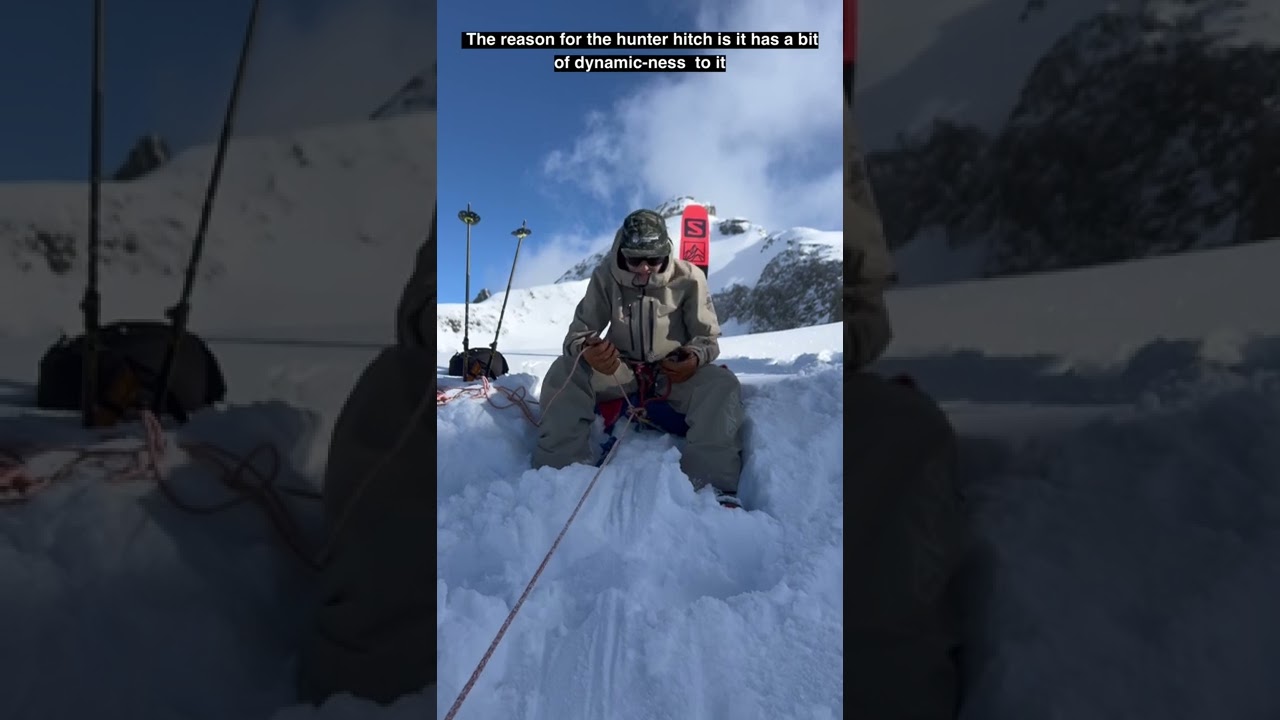 Belaying someone up or down a snow slope using the skis as an anchor.