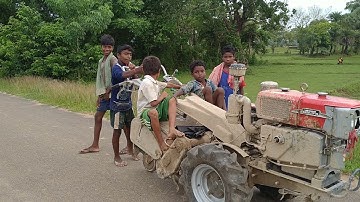 Small boy driving power tiller on road || Crazy village boys power tiller driving ||