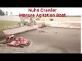 Nuhn Crawler manure agitation boat and our manure Lagoon