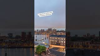 Aerial timelapse over Maashaven with moored ships, Katendrecht and Maas River Rotterdam, Netherlands