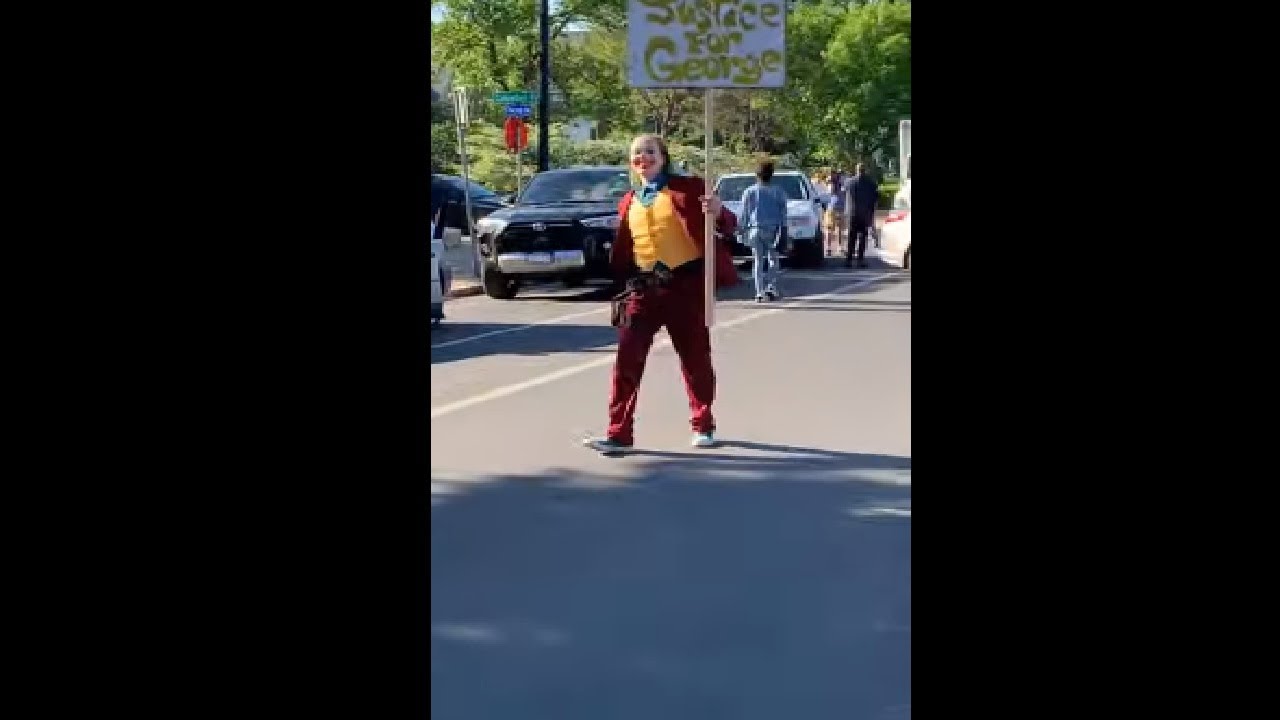 Man Walking In A Joker Costume In A Protest In Minneapolis